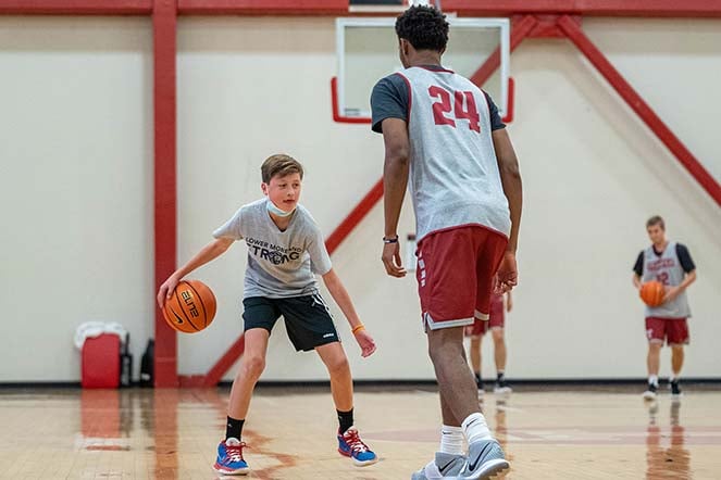 Cole playing on court with another player