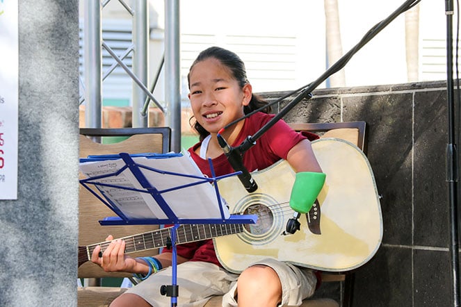 Danielle playing guitar