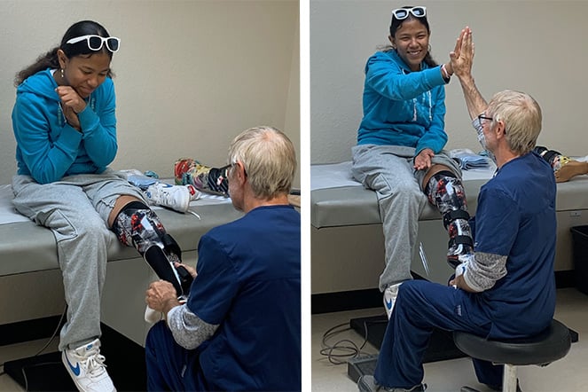 Danny helps patient Kayliahni's with her new Spiderman prosthetic leg.