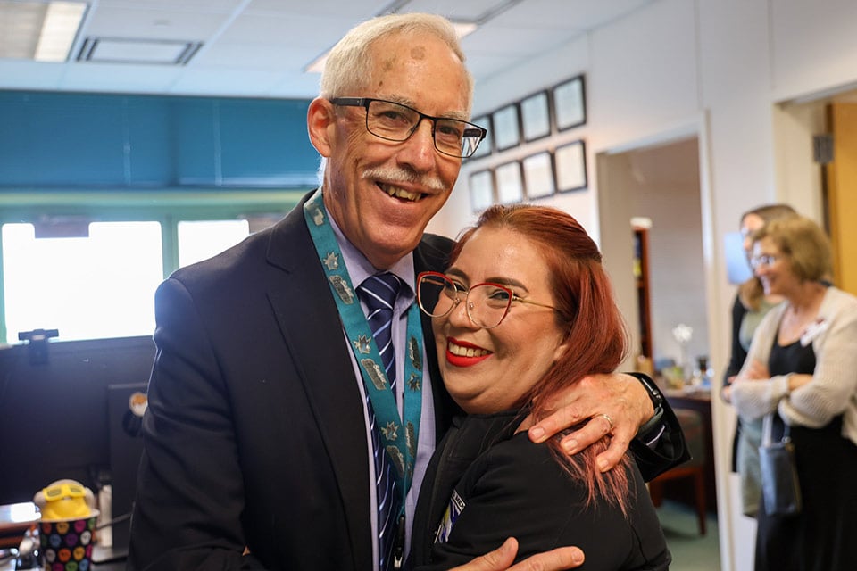 Dr. Barragan embraces her former doctor and mentor, Dr. Greenhalgh.