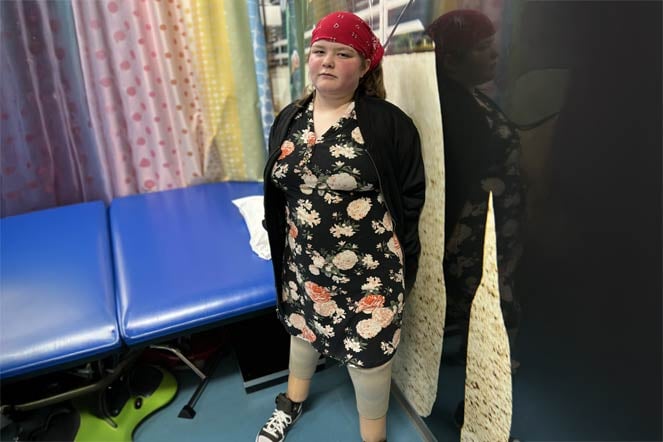 female orthopedic patient in exam room