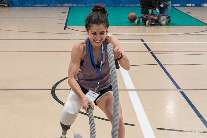 female exercising with ropes