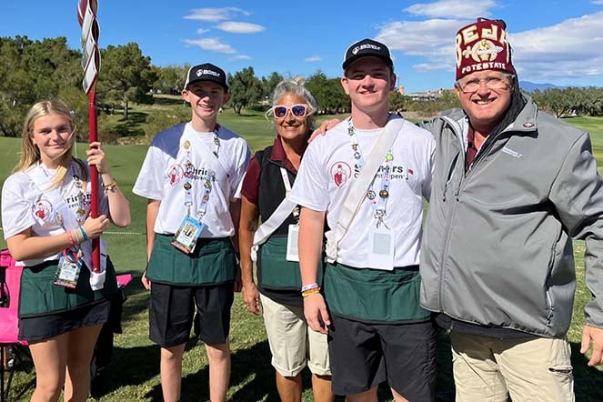cleft palate patient on golf course with four other people