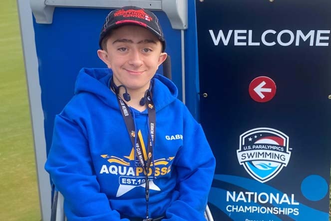 Gabriel at US Paralympic Swimming National Championships welcome sign
