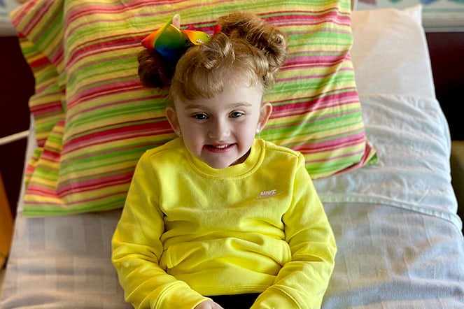 Hadley, lying down, smiling