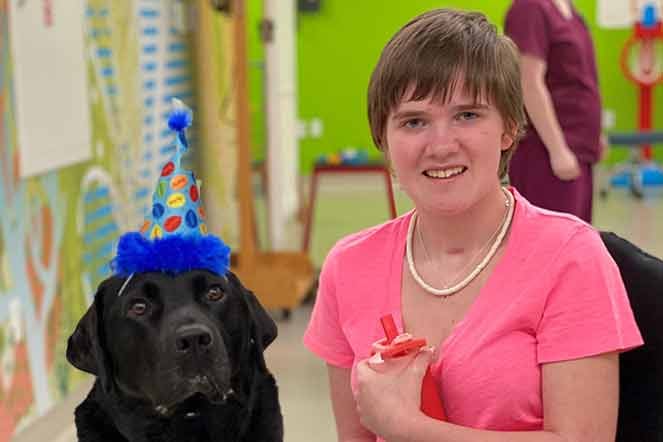 Hannah with therapy dog Declan