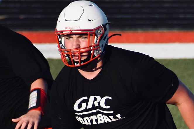 Hunter on field wearing helmet, shirt reads GRC Footgall