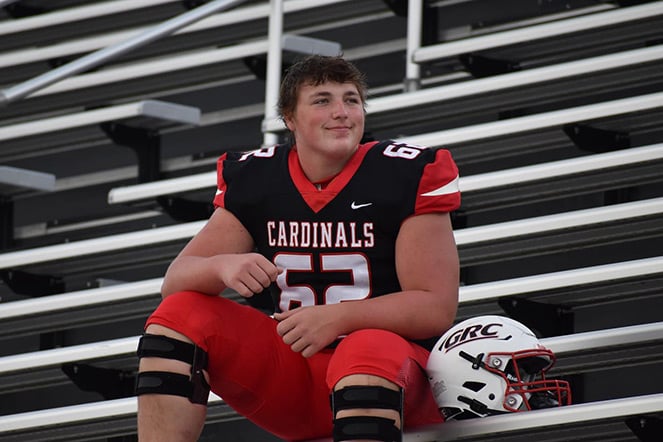 Hunter wearing uniform, jersey says "Cardinals"