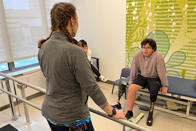 isaac listening to his physical therapists