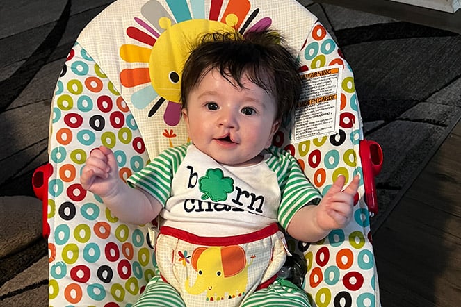 Jack smiling in his bouncy seat
