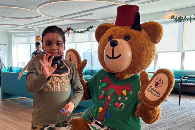 Jheron with Shriners bear