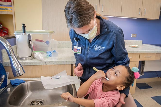 kammie brushing her teeth
