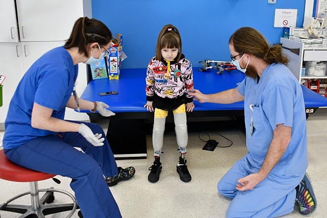 karolina standing with staff members