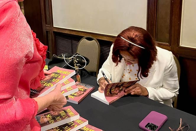 Kechi during booksigning