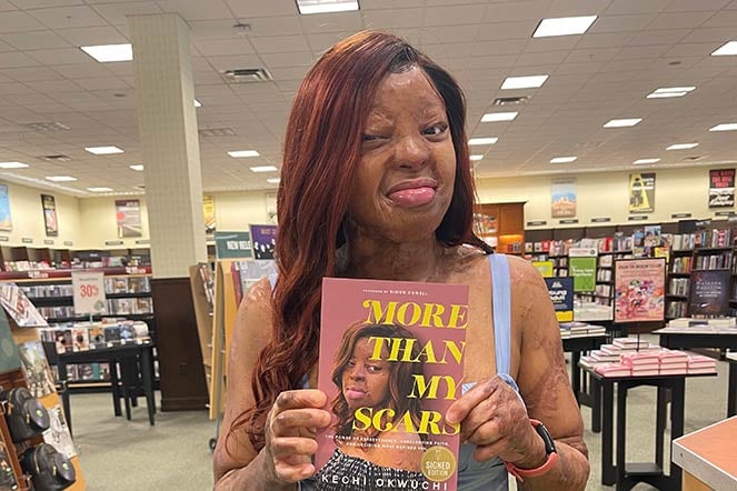 Kechi holding book