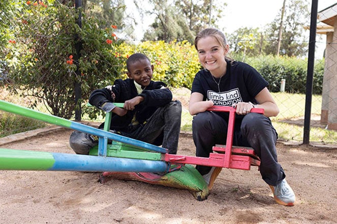 Keegan and prosthetic patient playing