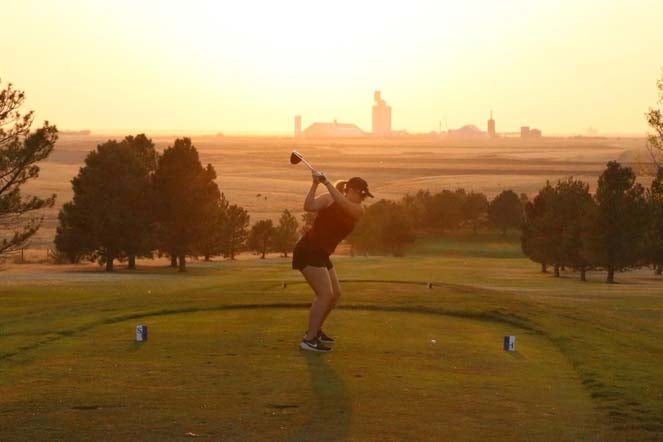 kerrigan swinging golf club