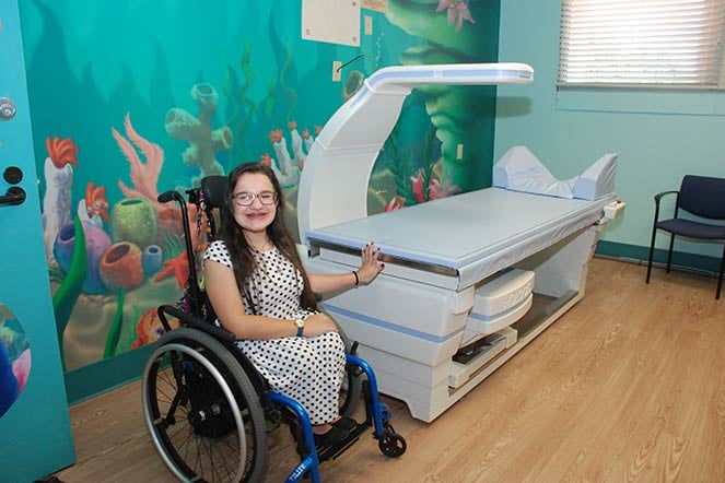 Leigh showing the DEXA scanning machine