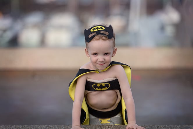 Liam wearing Batman scoliosis brace