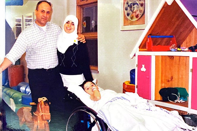 limb length discrepancy patient alongside his parents in a child's playroom