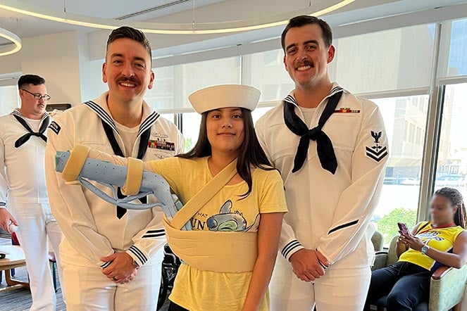 burn patient Litzy with two sailors