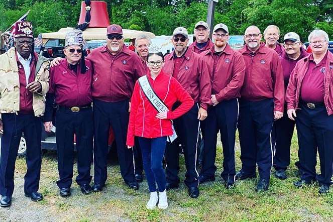Maddie with group of Shriners