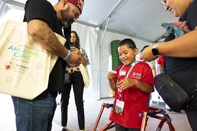 Manny receives a pin from a Shriner.
