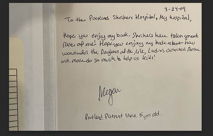 Megan's signature in book