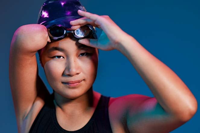Momo wearing swim cap and goggles