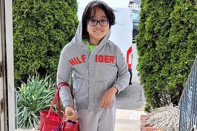 Myles carrying groceries