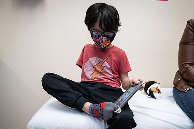 Myles playing video game