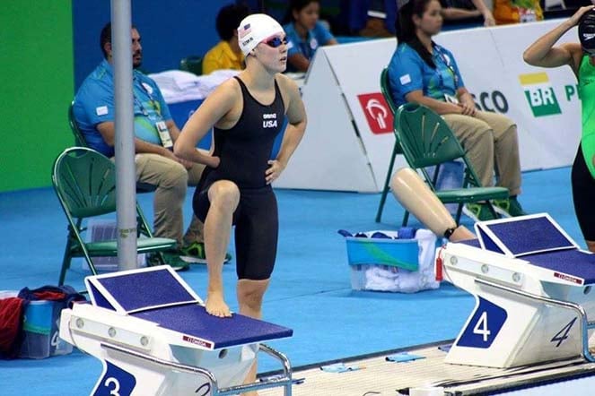 Natalie stepping onto starting block