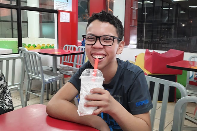 a child enjoying a milkshake