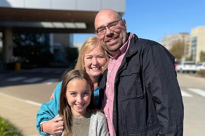 owyn smiling with family