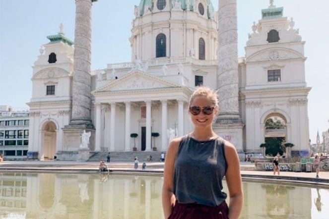 Elena in front of building in Russia