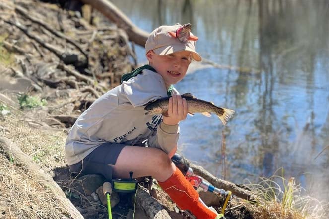 orthopedic patient holding fish
