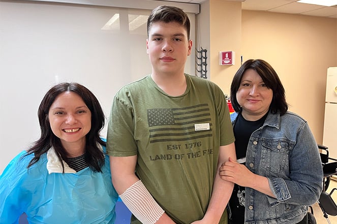 Patient with mother and physical therapist