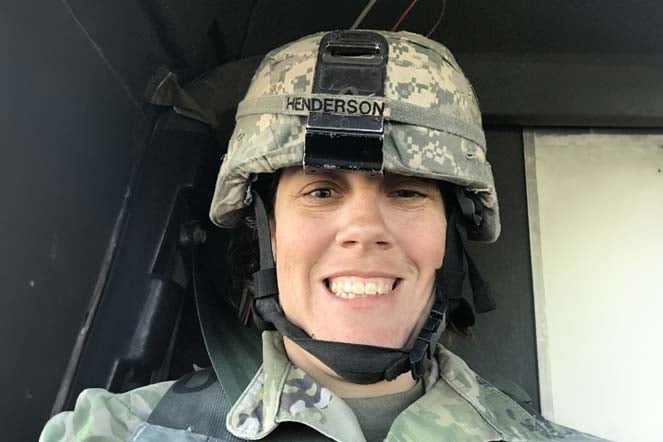 Peggy in uniform, wearing helmet