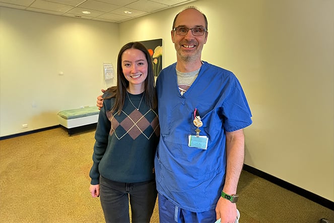 Peighten with Todd DeWees in the lobby of a building