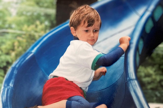 Peter on sliding board
