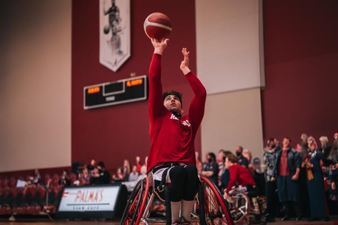 Peter shooting basketball