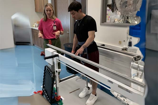 prosthetic patient with physical therapist during therapy session
