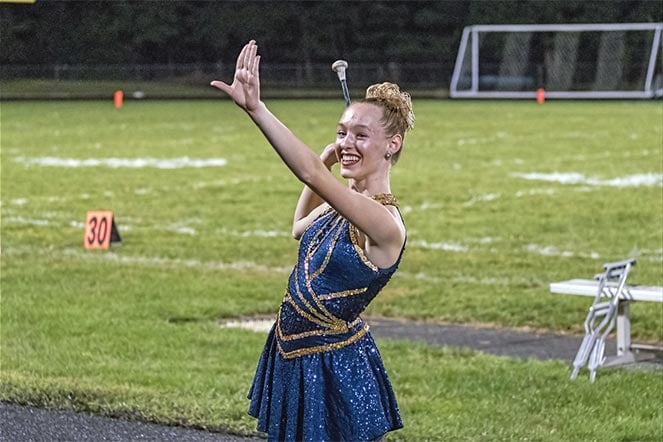 Rachel on field during performance