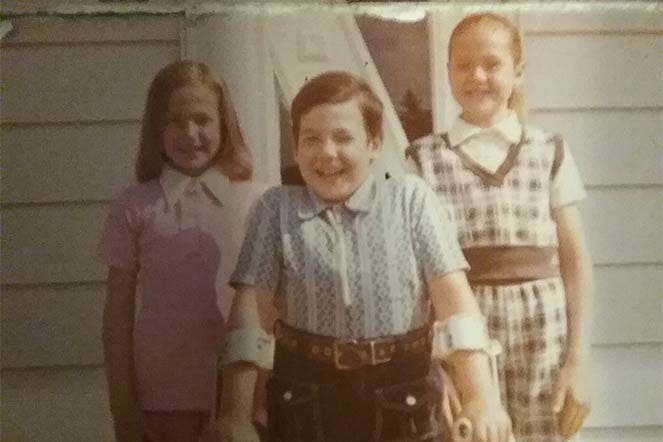 Richard on crutches, with his sisters
