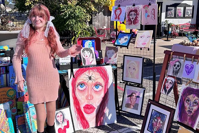 arthrogryposis patient Sadie with artwork