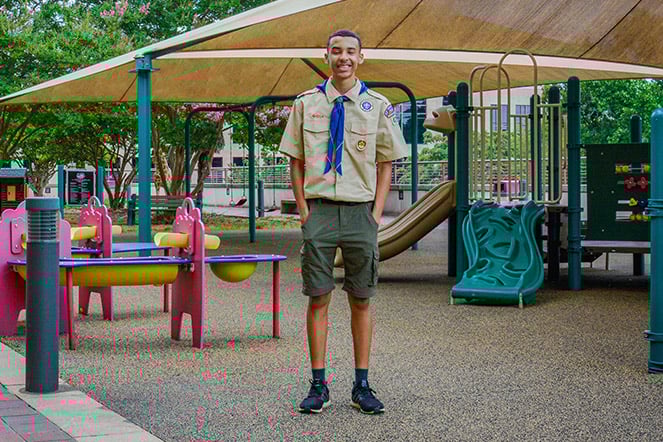 Shane standing on playground