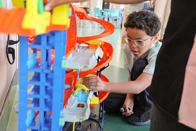 Silas playing with matchbox cars