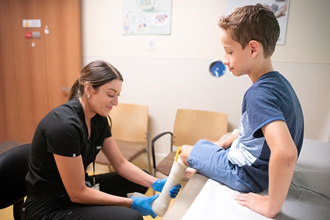 Spina bifida patient being fitted for a cast by an Orthotist
