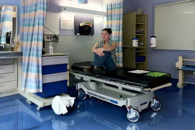 a patient sitting on an examination table