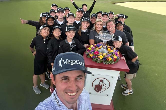 large group of standard bearers and professional golfer